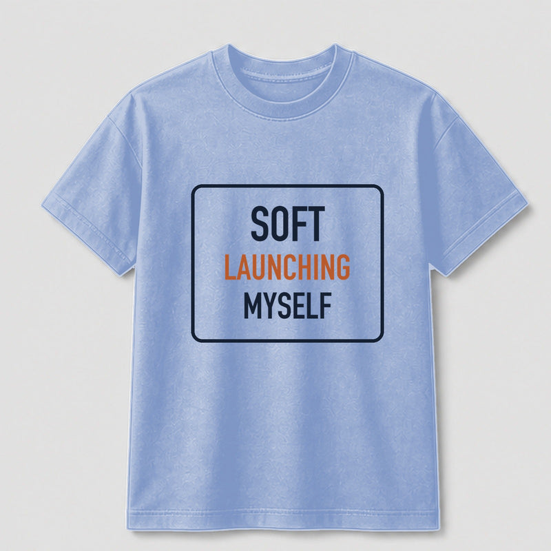 Soft Launching Myself graphic tee by Threadmates featuring original internet culture artwork on light blue t-shirt, front.